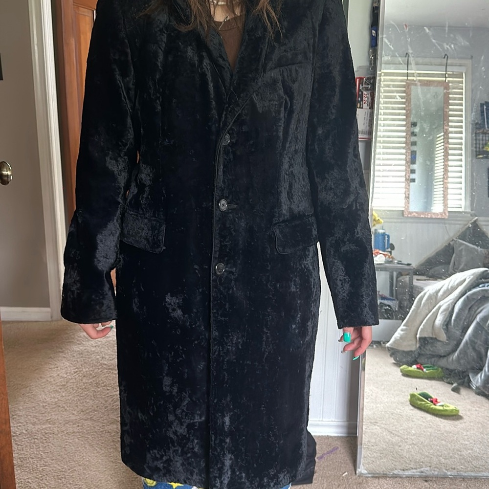 Fuzzy coat button down with pockets on both sides.